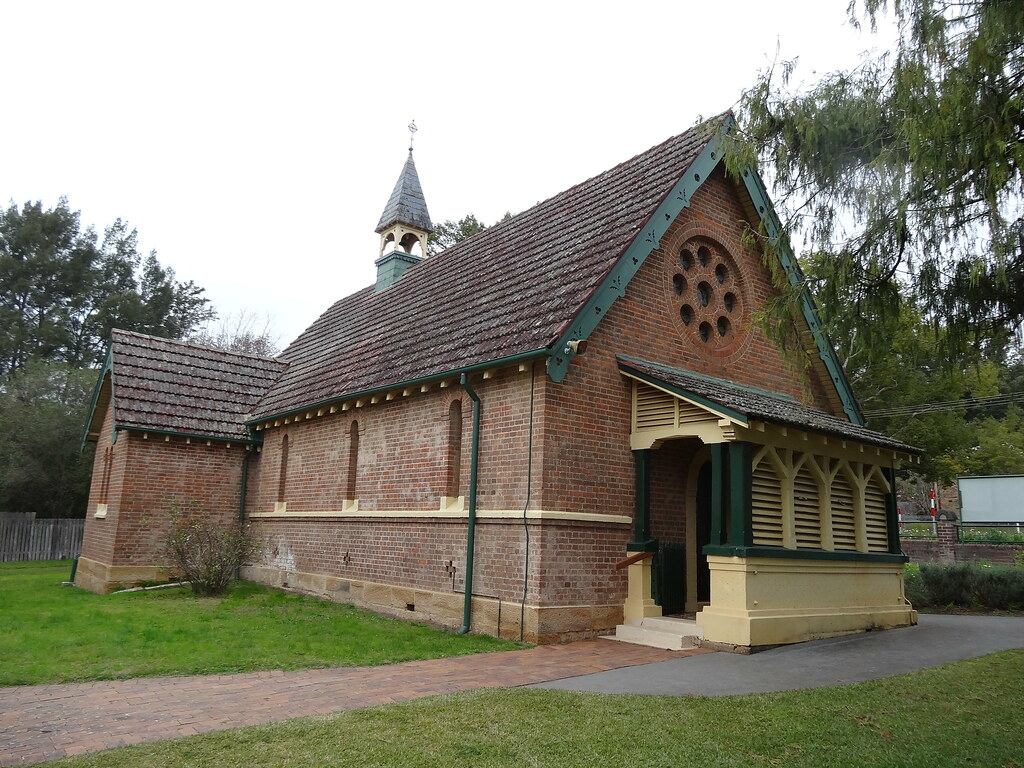 Commercial roofing project showing multiple skilled workers installing new roof on large industrial building with professional team coordination and modern safety standards